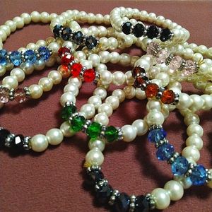 12 Pearl Bracelets with crystals.